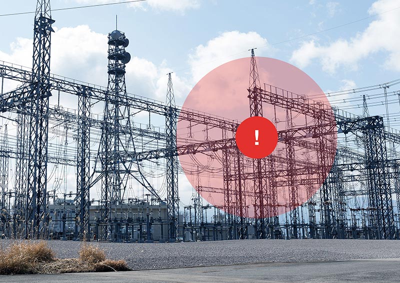 A red alert circles appears over a power station signifying a potential issue